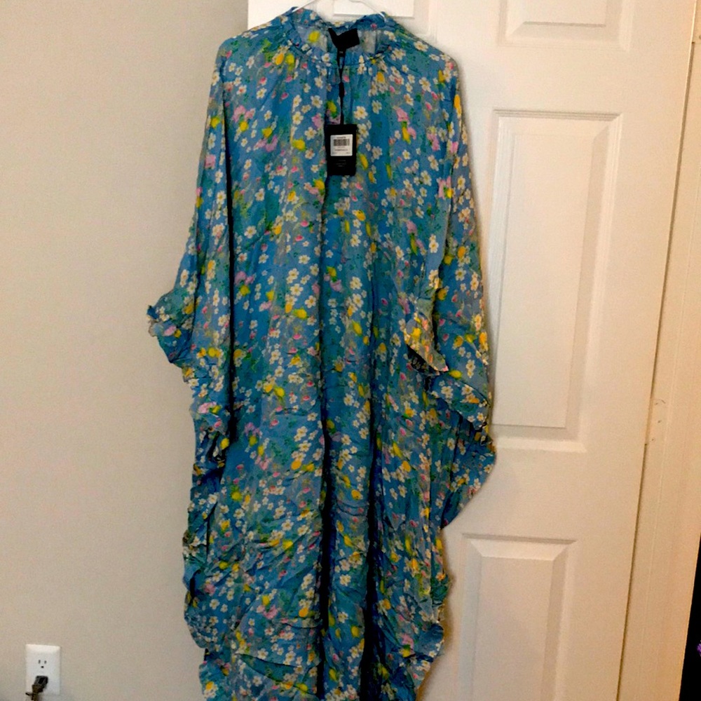 NEVER WORN. New with tags. Floral printed. Side slits length Maxi.